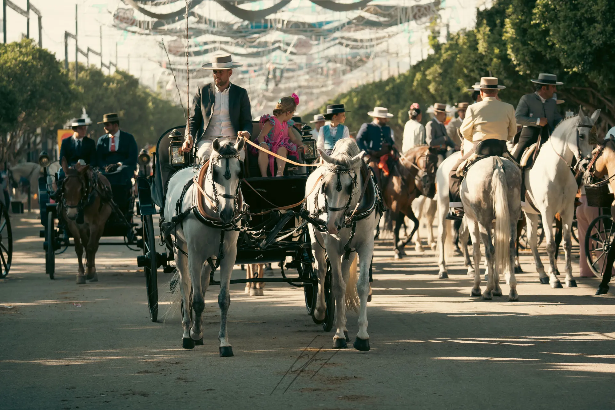 Riders and white horses at the Feria de Málaga.