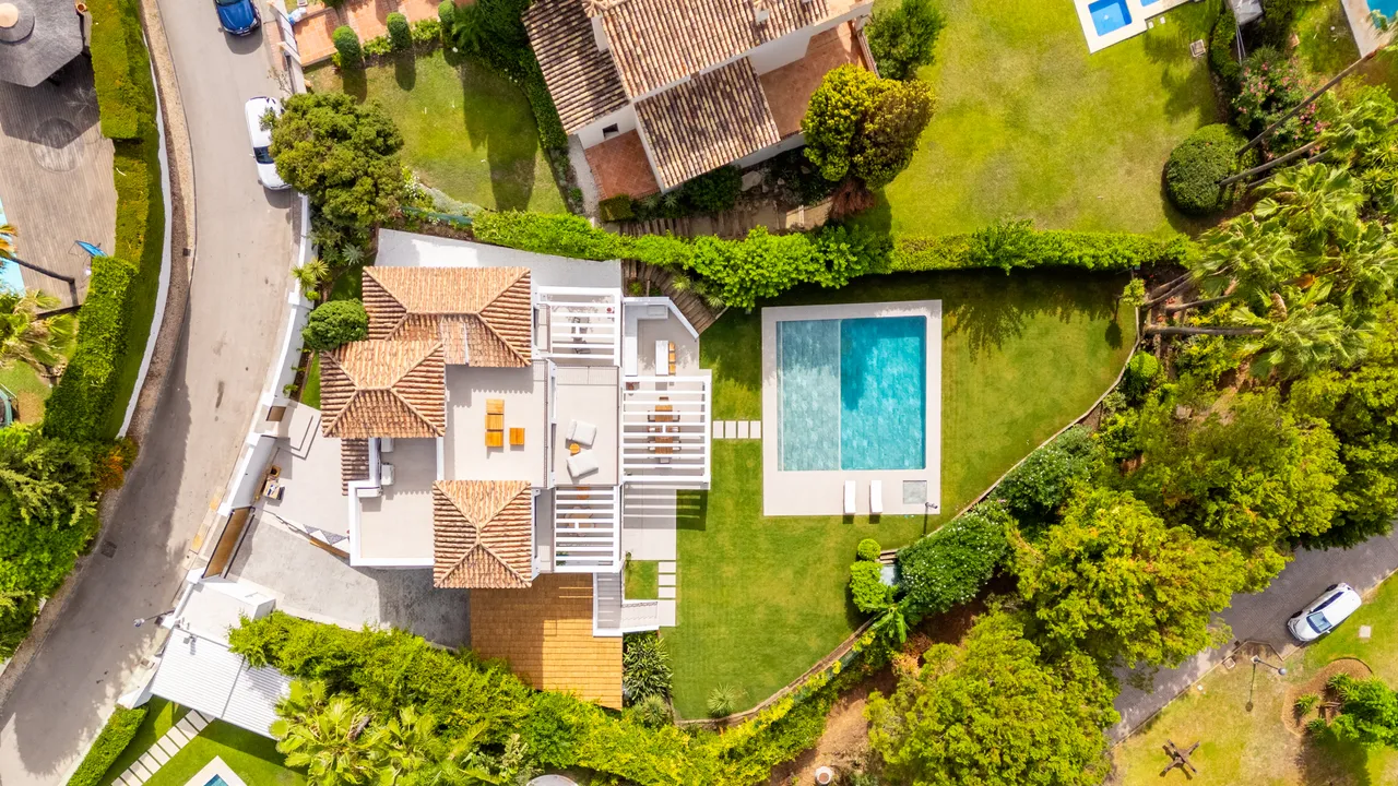 Aerial drone view of a villa with pool and garden on the Costa del Sol.