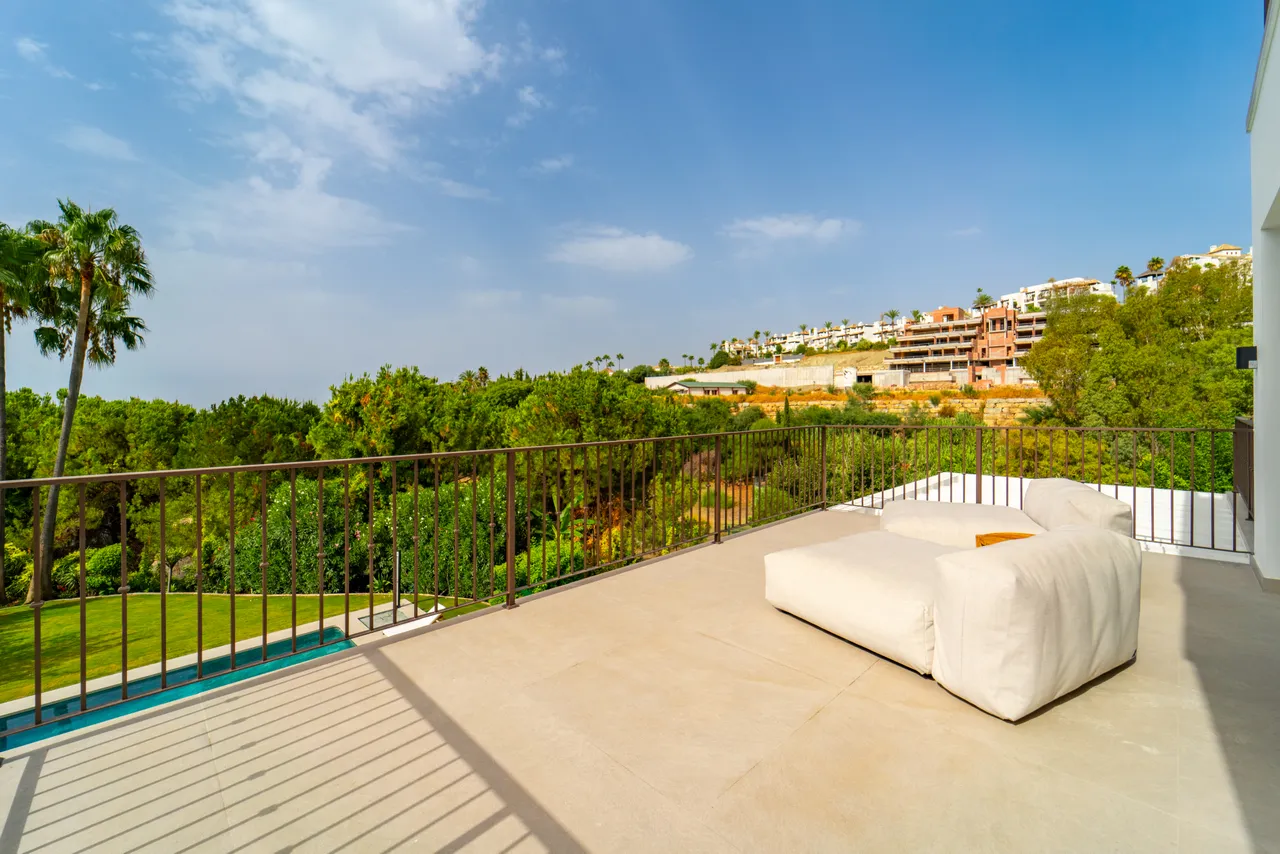 Sunlit villa terrace overlooking the hills of the Costa del Sol.